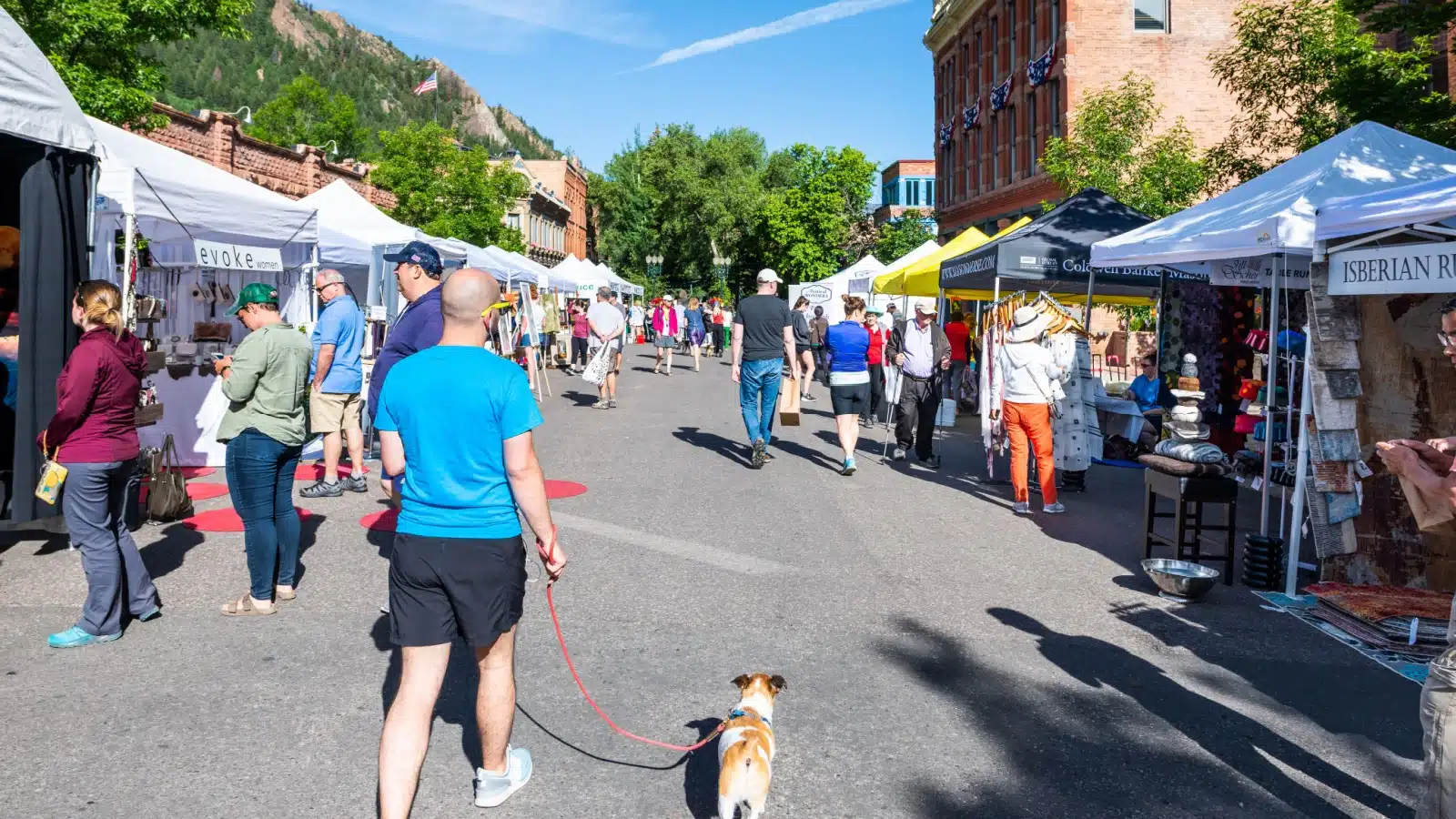 Vendors line the street during a summer festival in Aspen, Colorado.