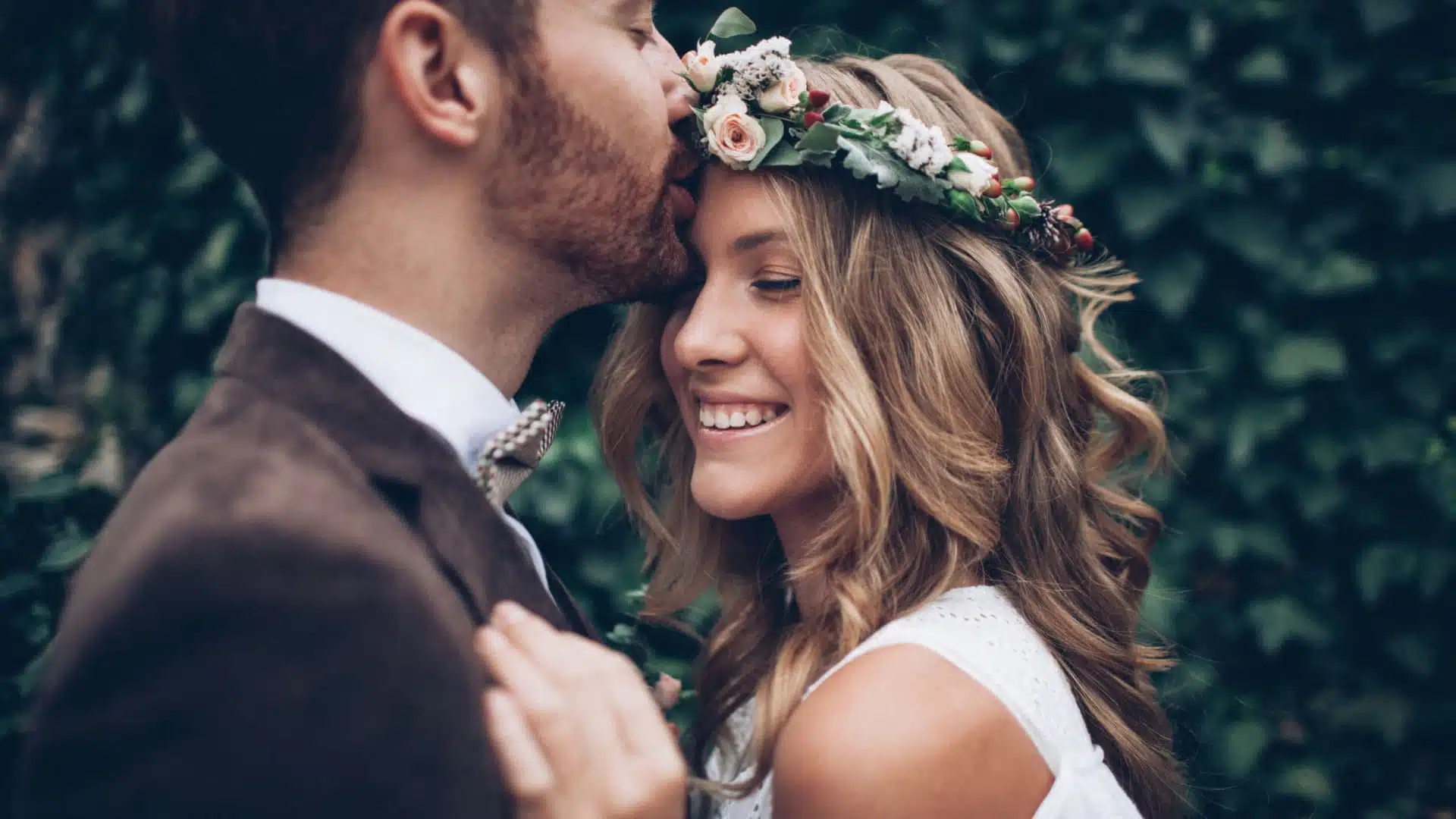 Happy bride and groom embracing at their wedding.