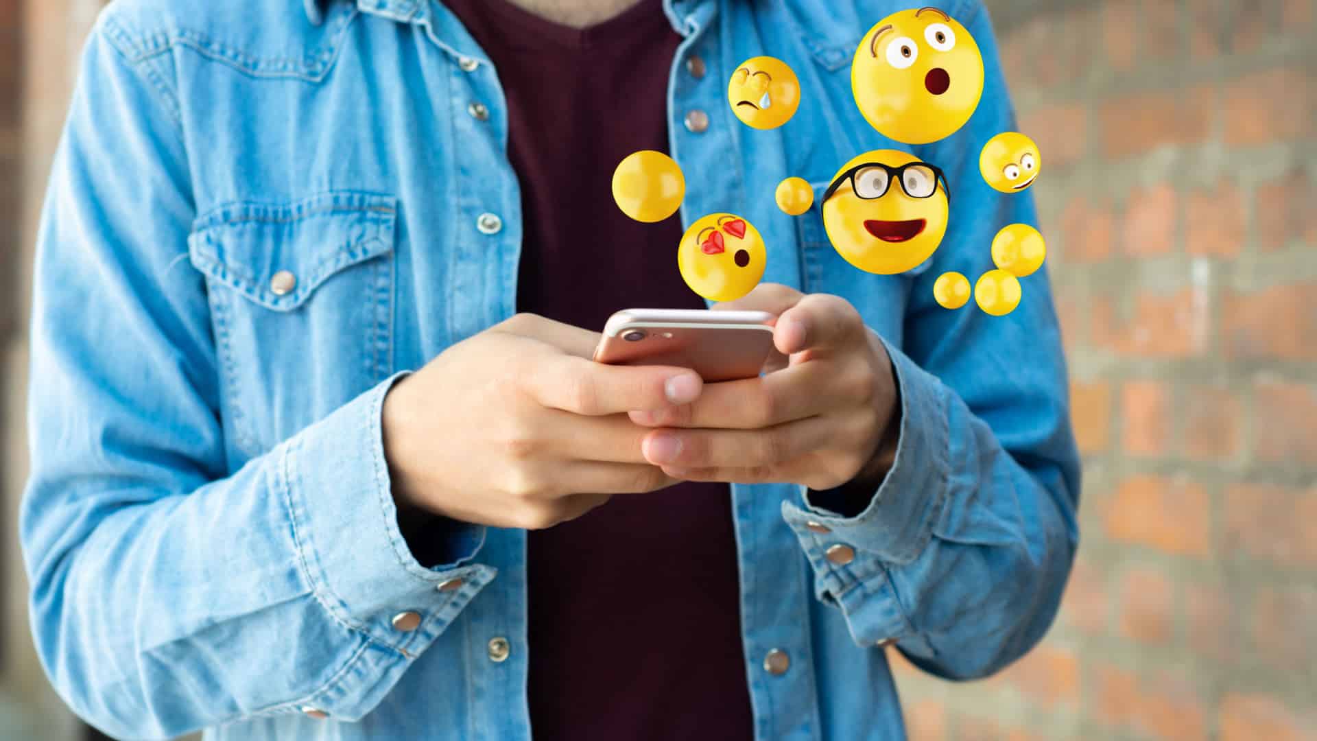 person using their phone with various graphic emoticons popping out.