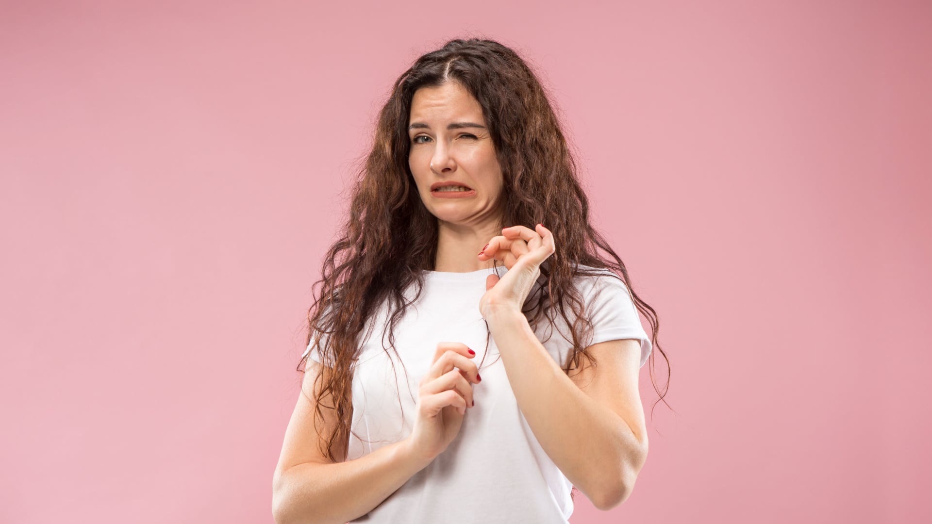 Woman recoiling as if she's grossed out.