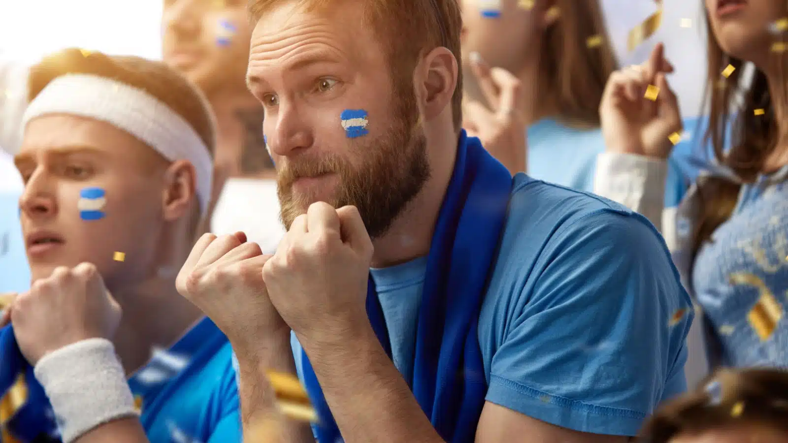 Tense fans anxiously watch the game.