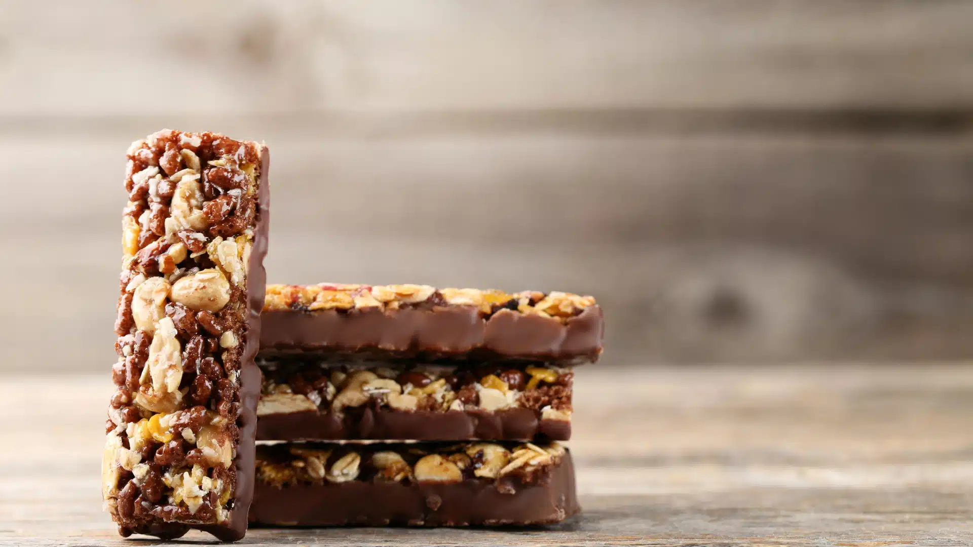Small stack of breakfast bars with granola and chocolate. 