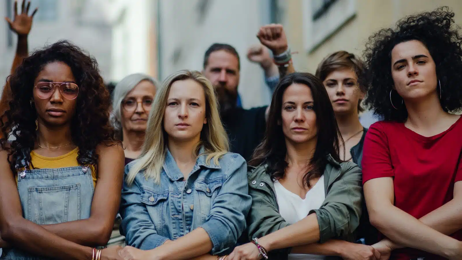 A group of feminists hold the line, demanding equality.