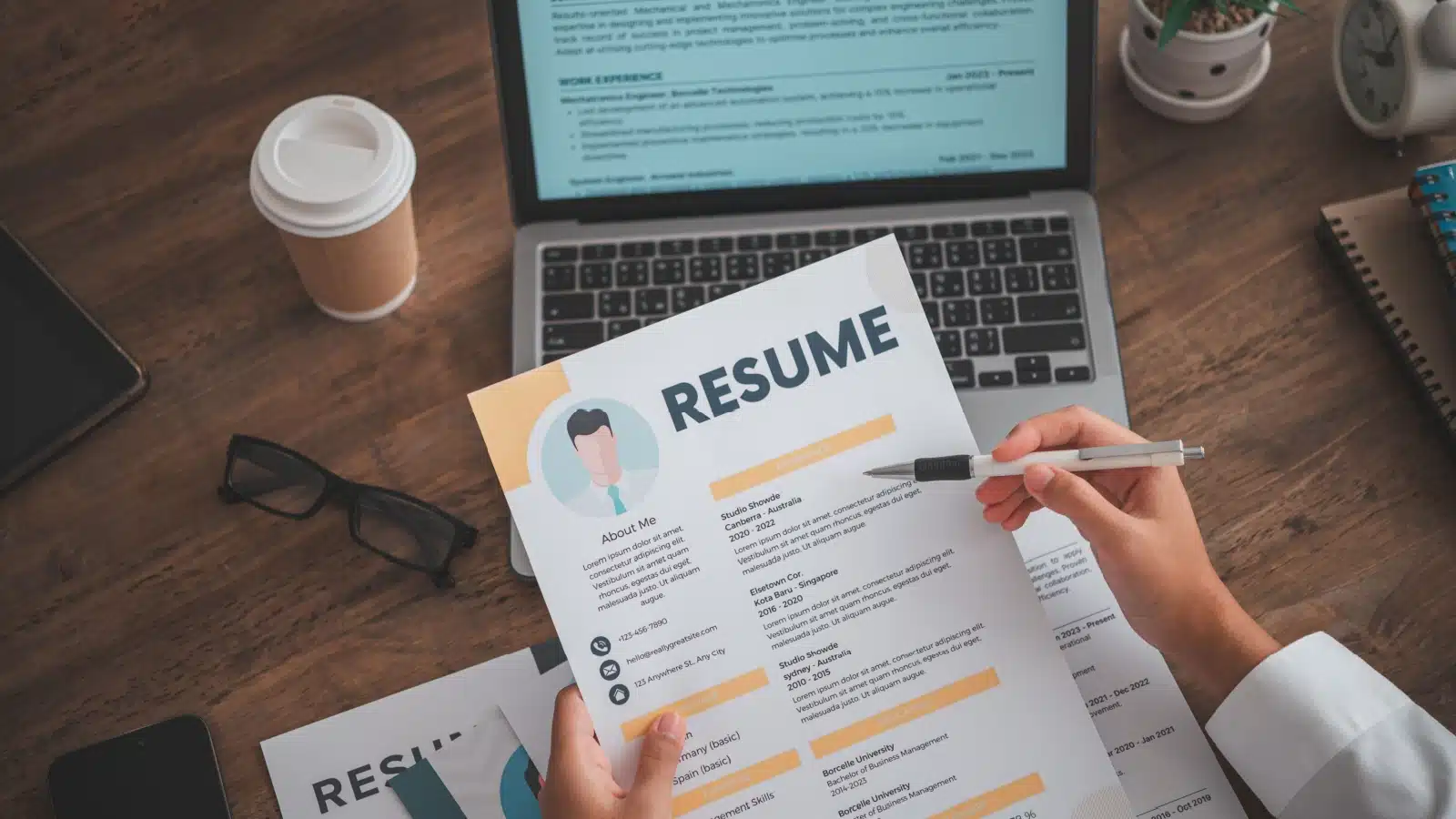 A person reviewing a resume.