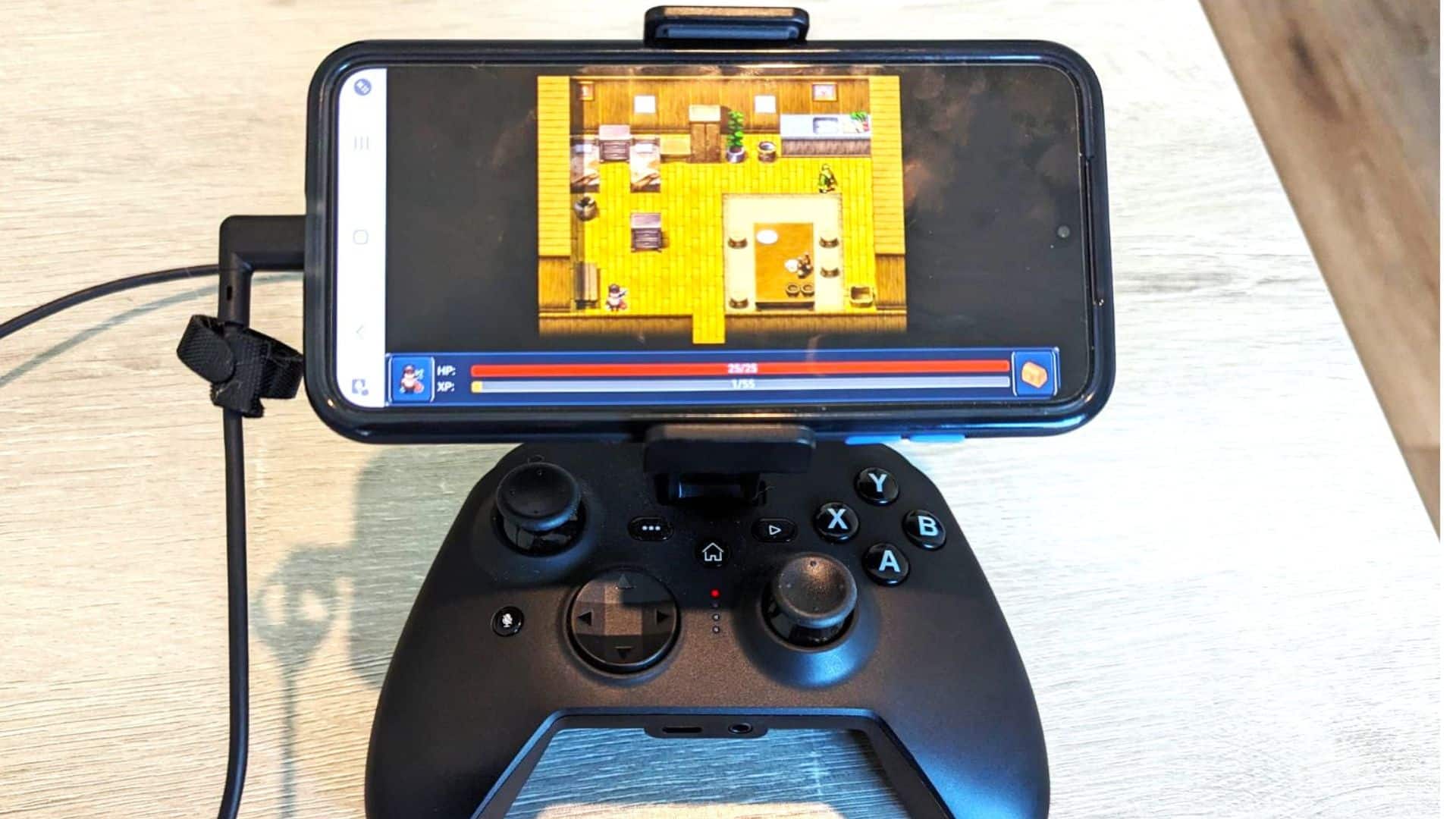 RiotPwr Controller attached to phone displaying a game.