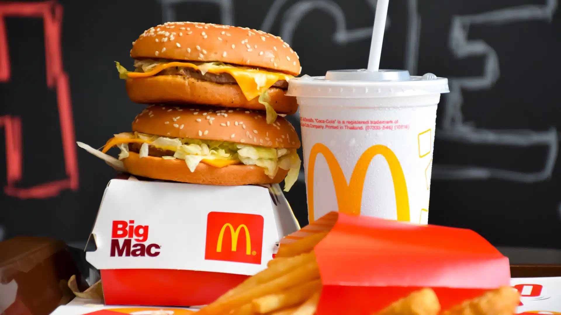 Large stack of McDonald's food and branded McDonald's food packaging.
