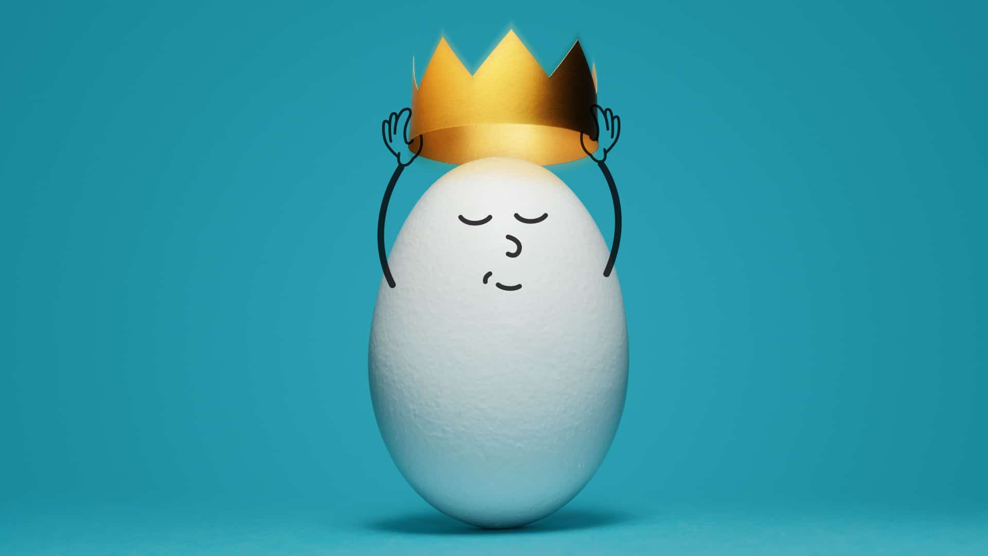 A white egg with a little face drawn on it placing a small crown on it's own head.
