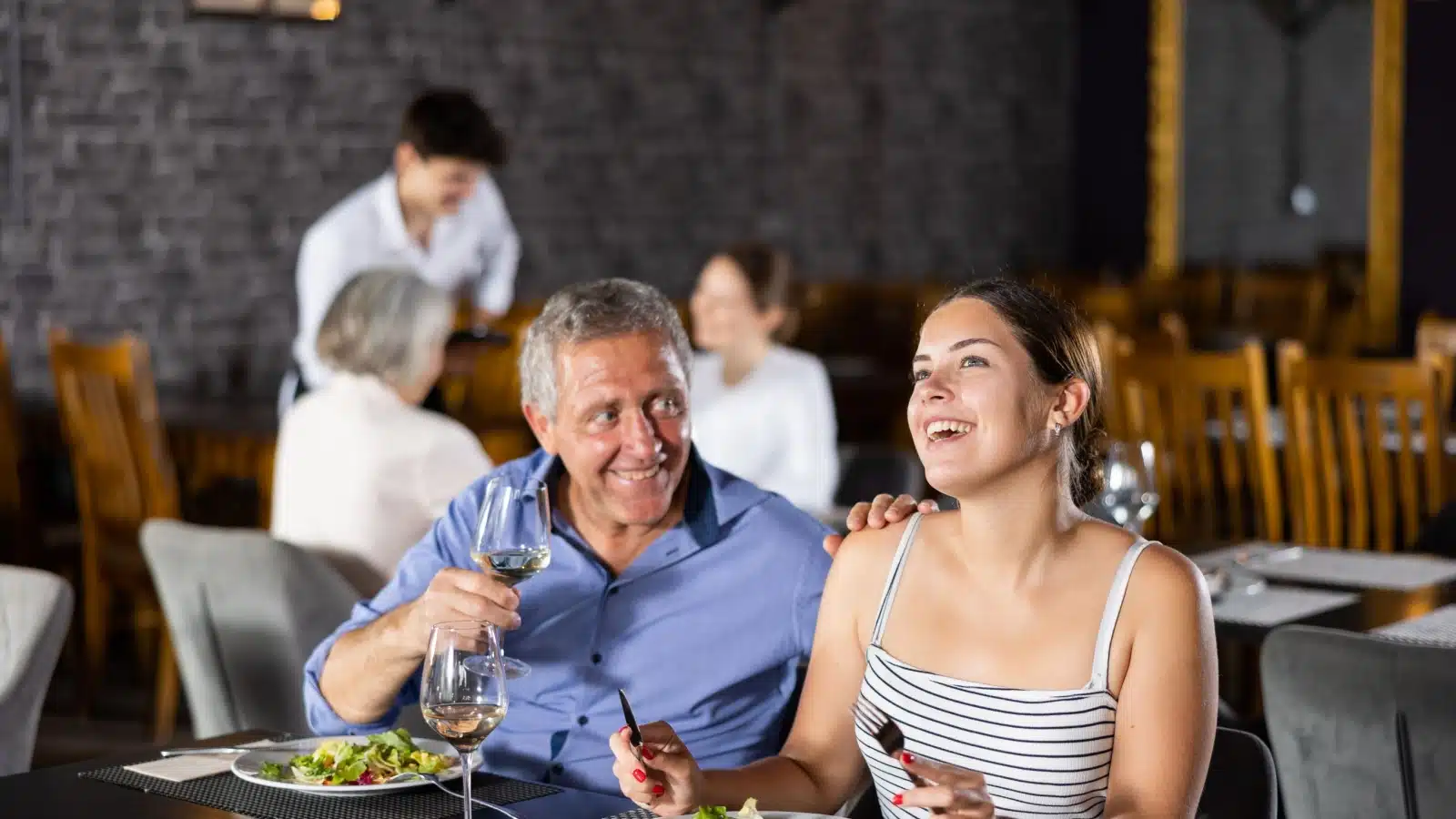 A couple with a big age difference on a date, to represent age gap relationships.