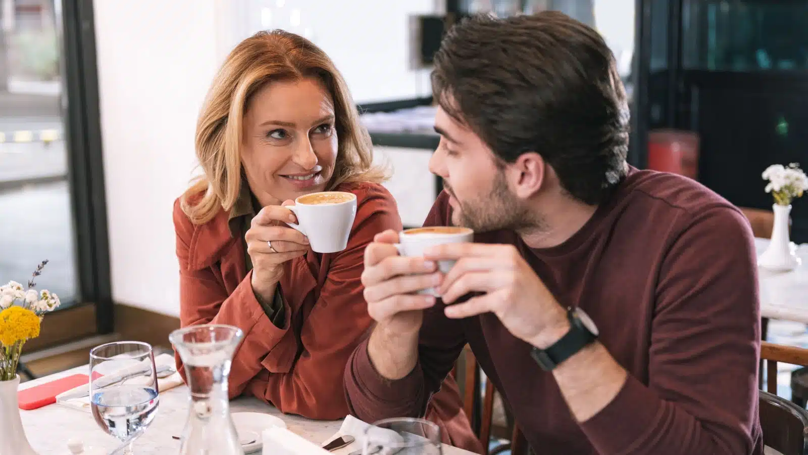 A couple in an age gap relationship on a coffee date.