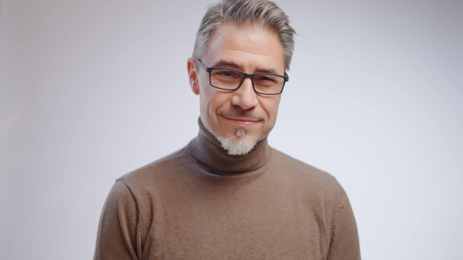 Portrait of an older, distinguished man a little older than middle aged.