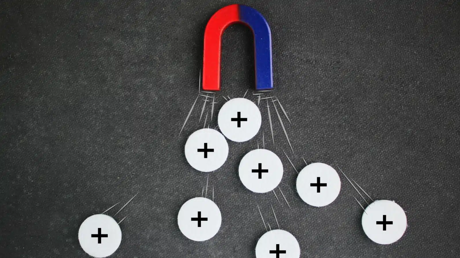 A magnet attracting only positive icons - to represent attracting positive energy.