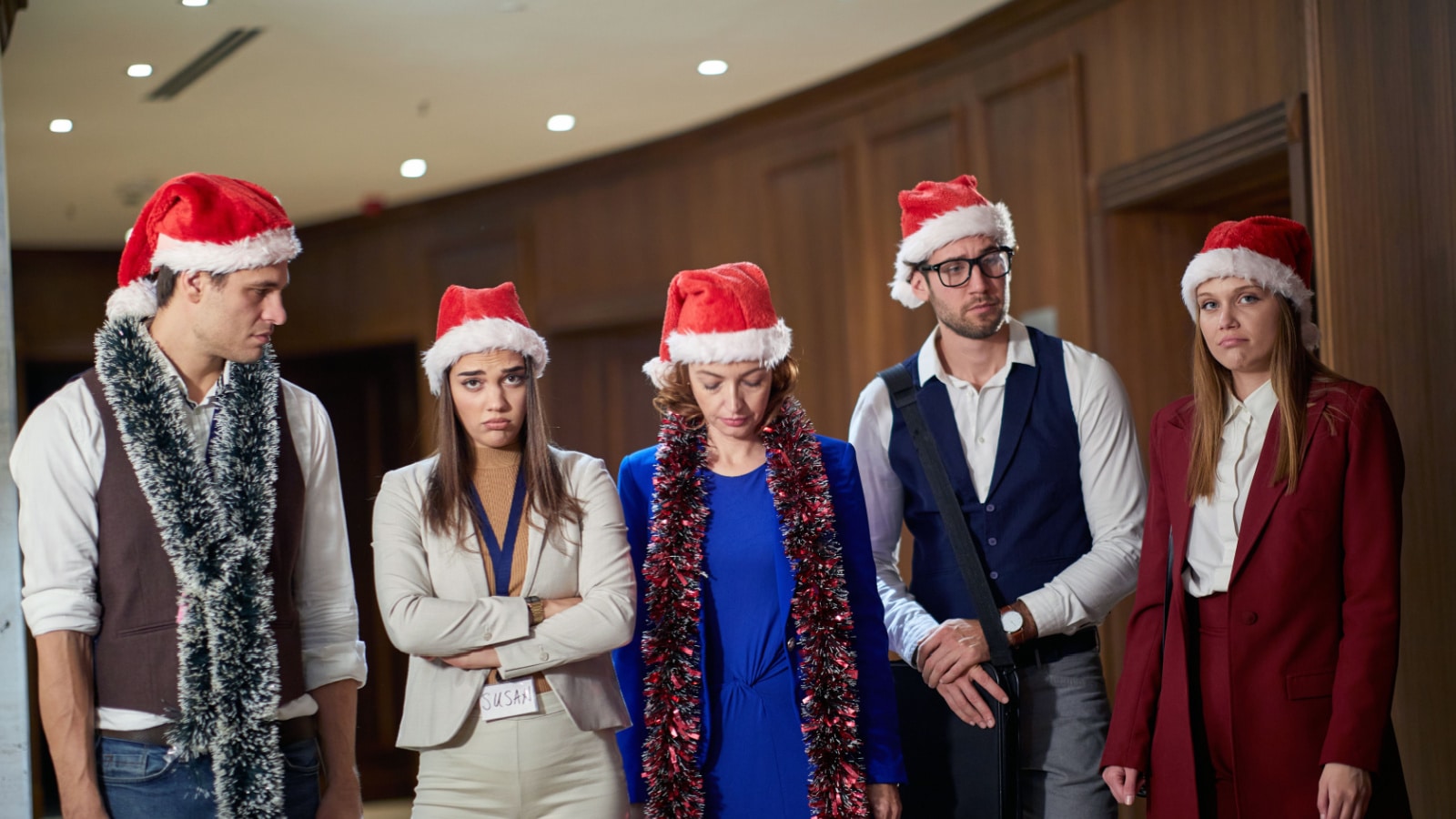 A group of workers at an office holiday party who clearly don't want to be there.