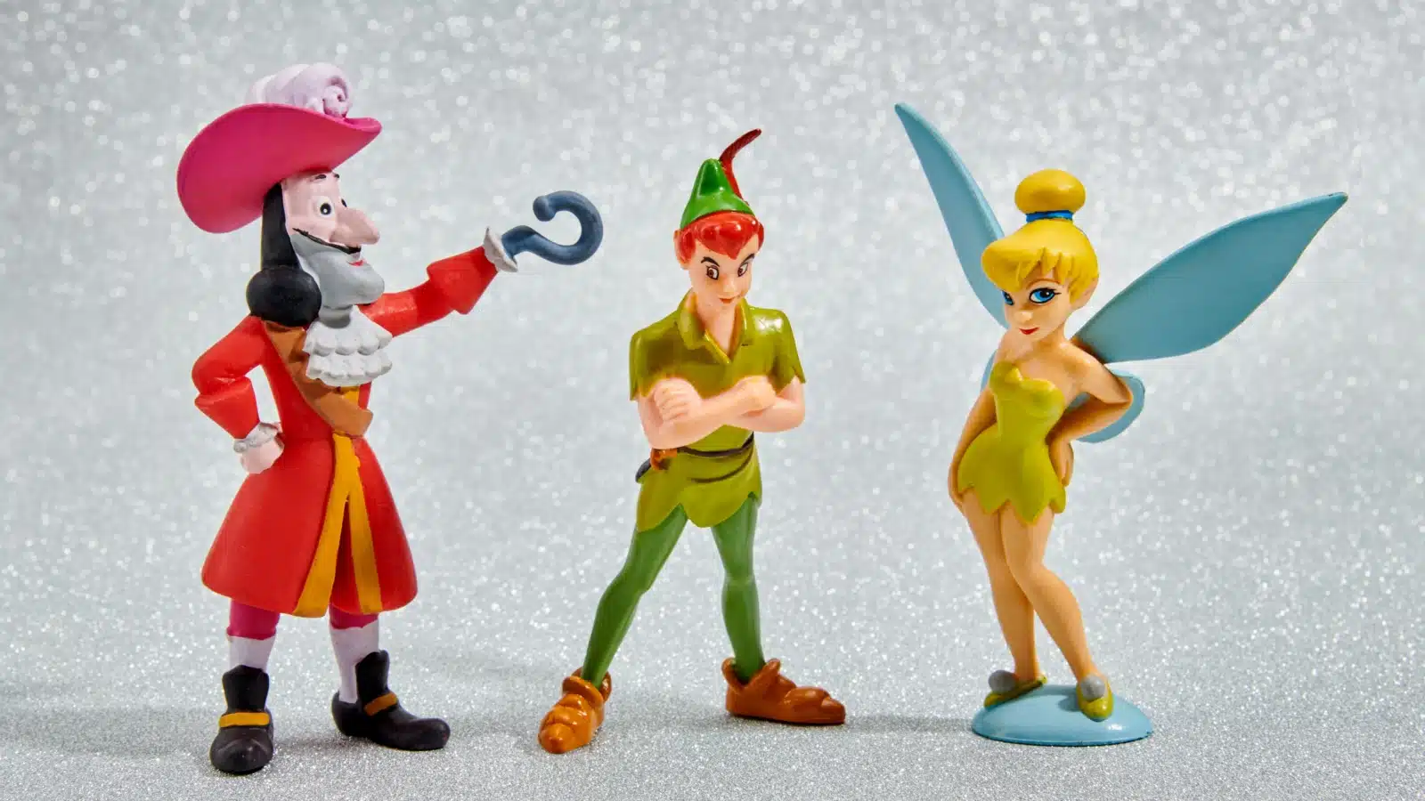 Small Toys from the Peter Pan movie: Captain Hook, Peter Pan, and Tinkerbell.