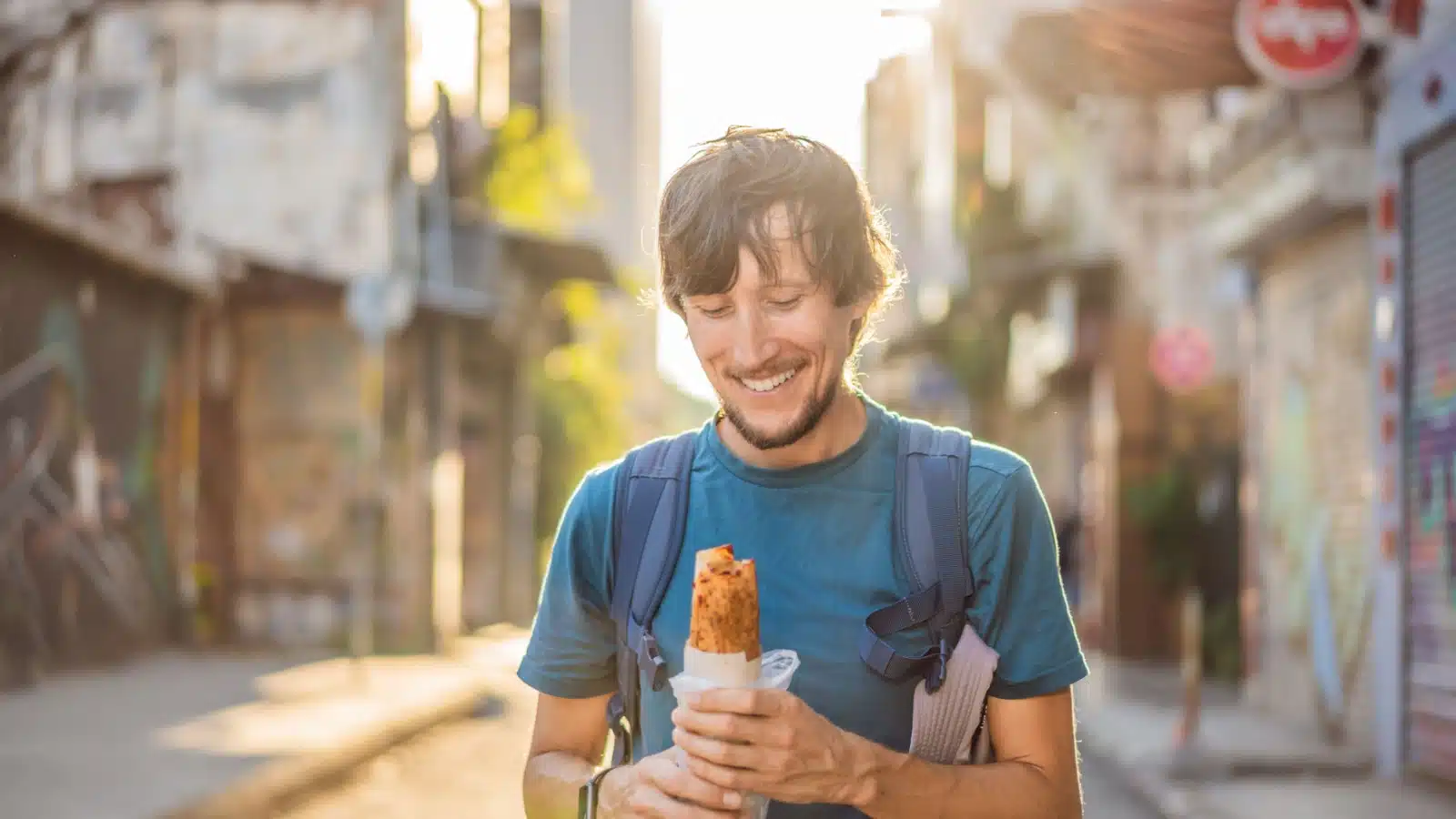 A happy man about to eat street food in Istanbul.