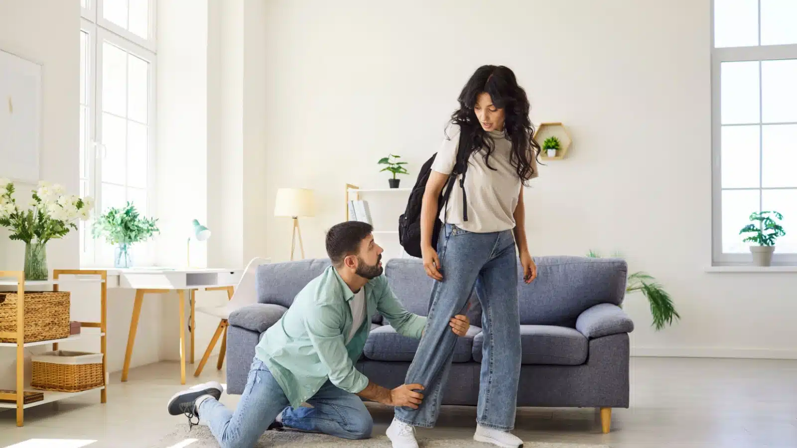 A husband begs his wife to stay as she's trying to leave him for good.