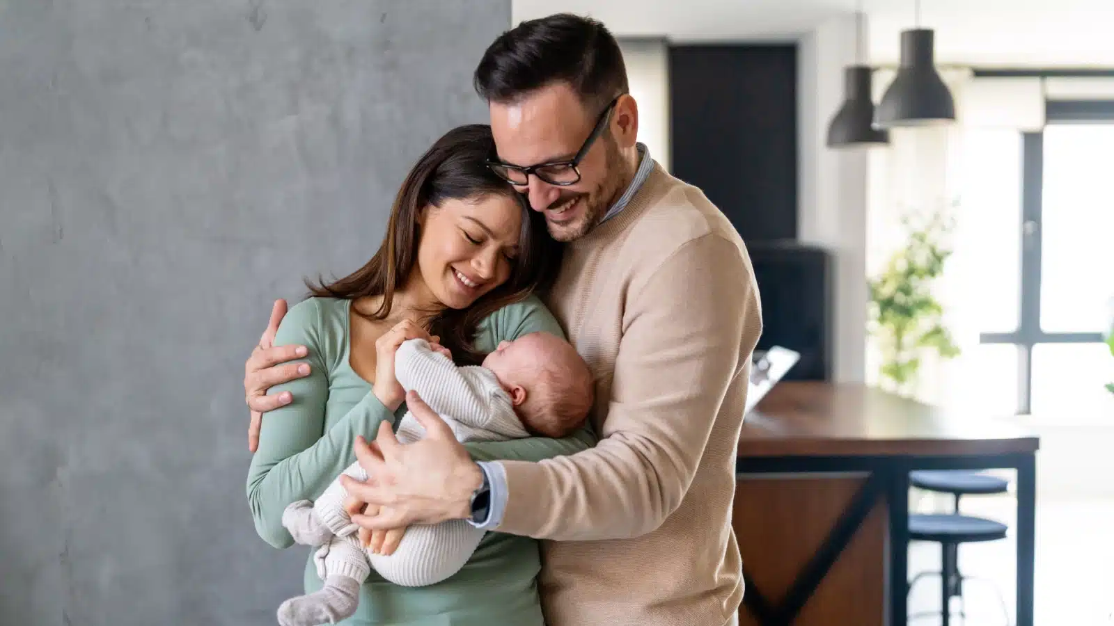 happy parents with a newborn baby.