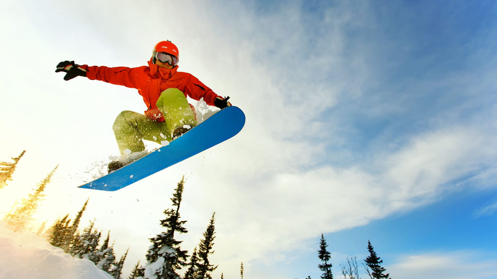 Snowboarder doing a jump on the board.