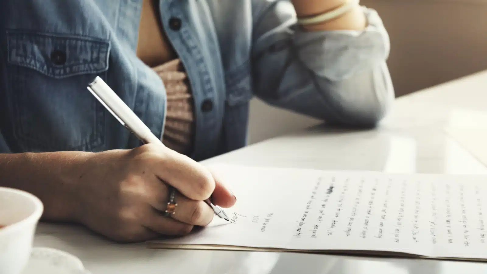 A woman writing a letter.