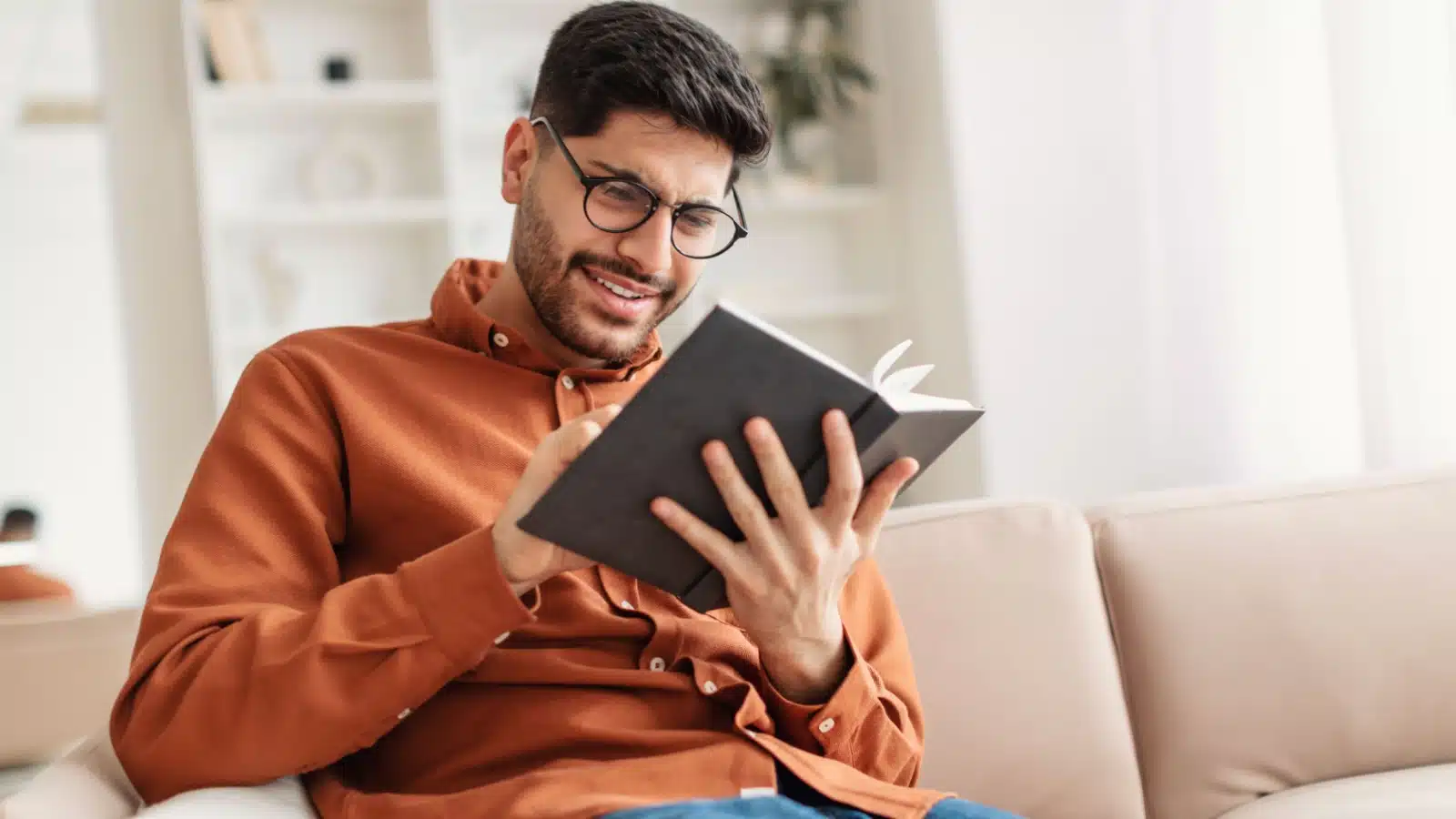 A young man reading a book.