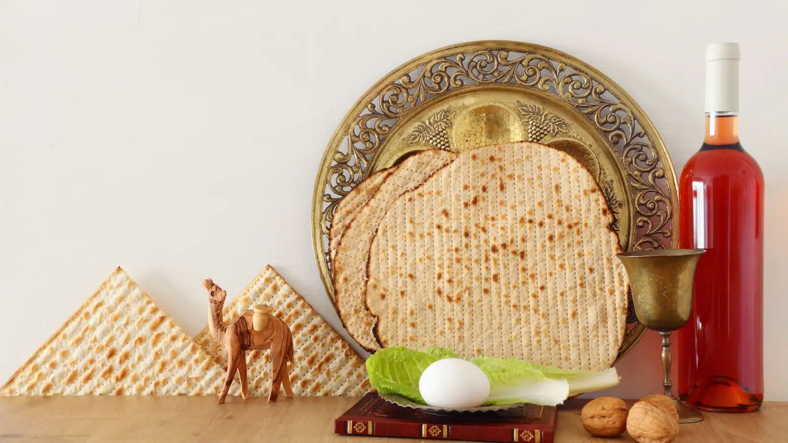 Passover holiday concept art featuring various items traditionally used in a Passover celebration.