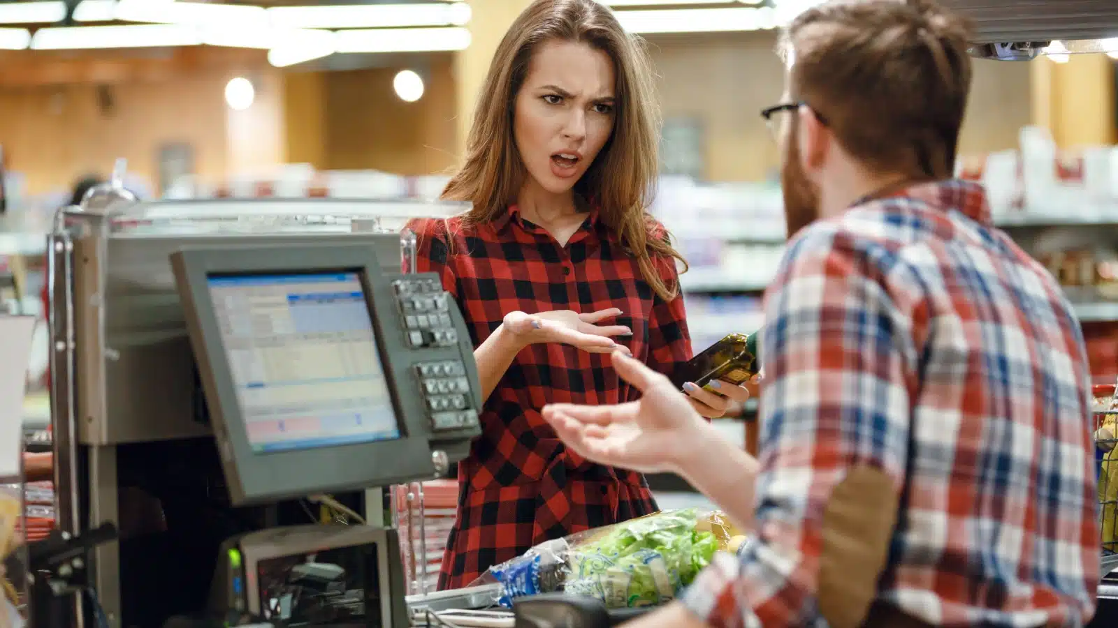 A customer being rude to a check out clerk to represent how we're normalizing bad behavior. 