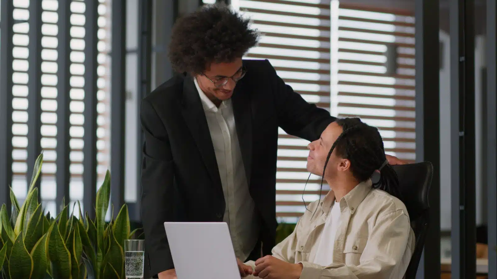 A dependable boss checks in on one of his staff members.