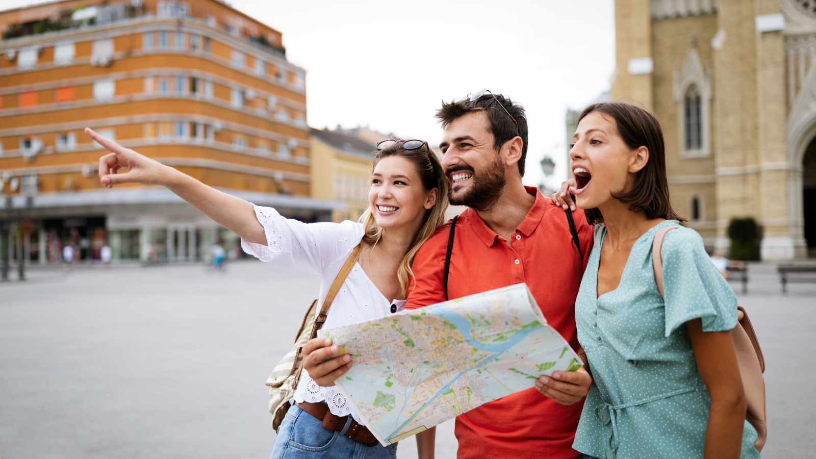 Three friends traveling together, sightseeing.