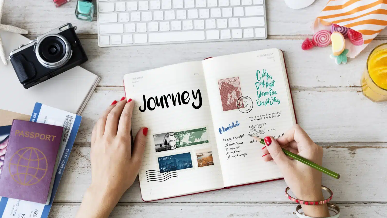 A woman uses a journal to plan her trip.