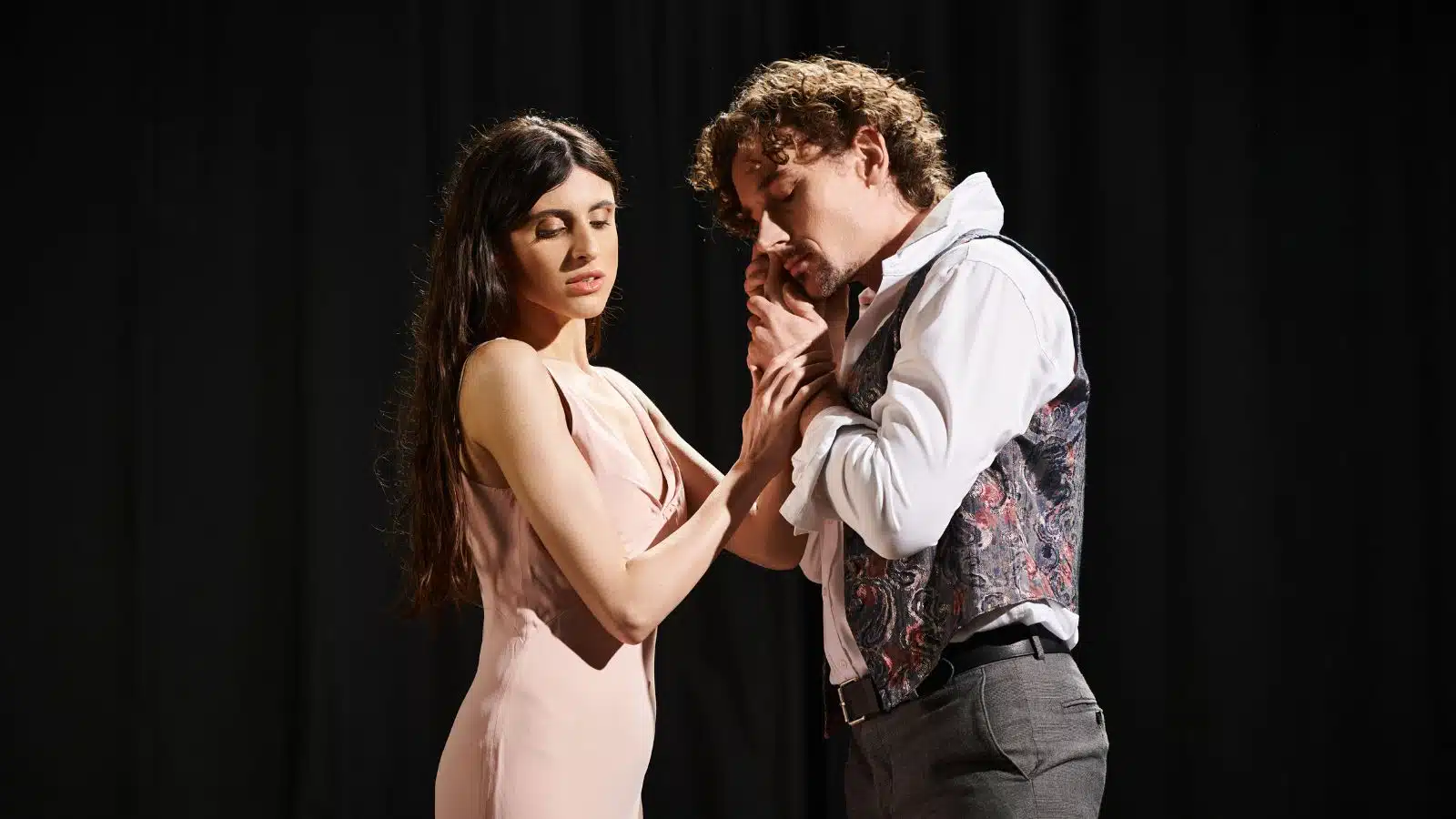 Dramatic stage actors representing Romeo & Juliet, to depict toxic relationships. 