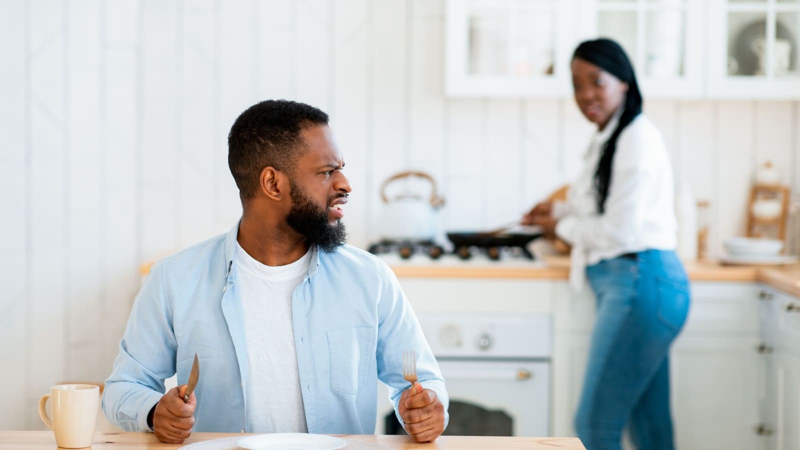 A man complains that dinner isn't ready while refusing to help with housework.