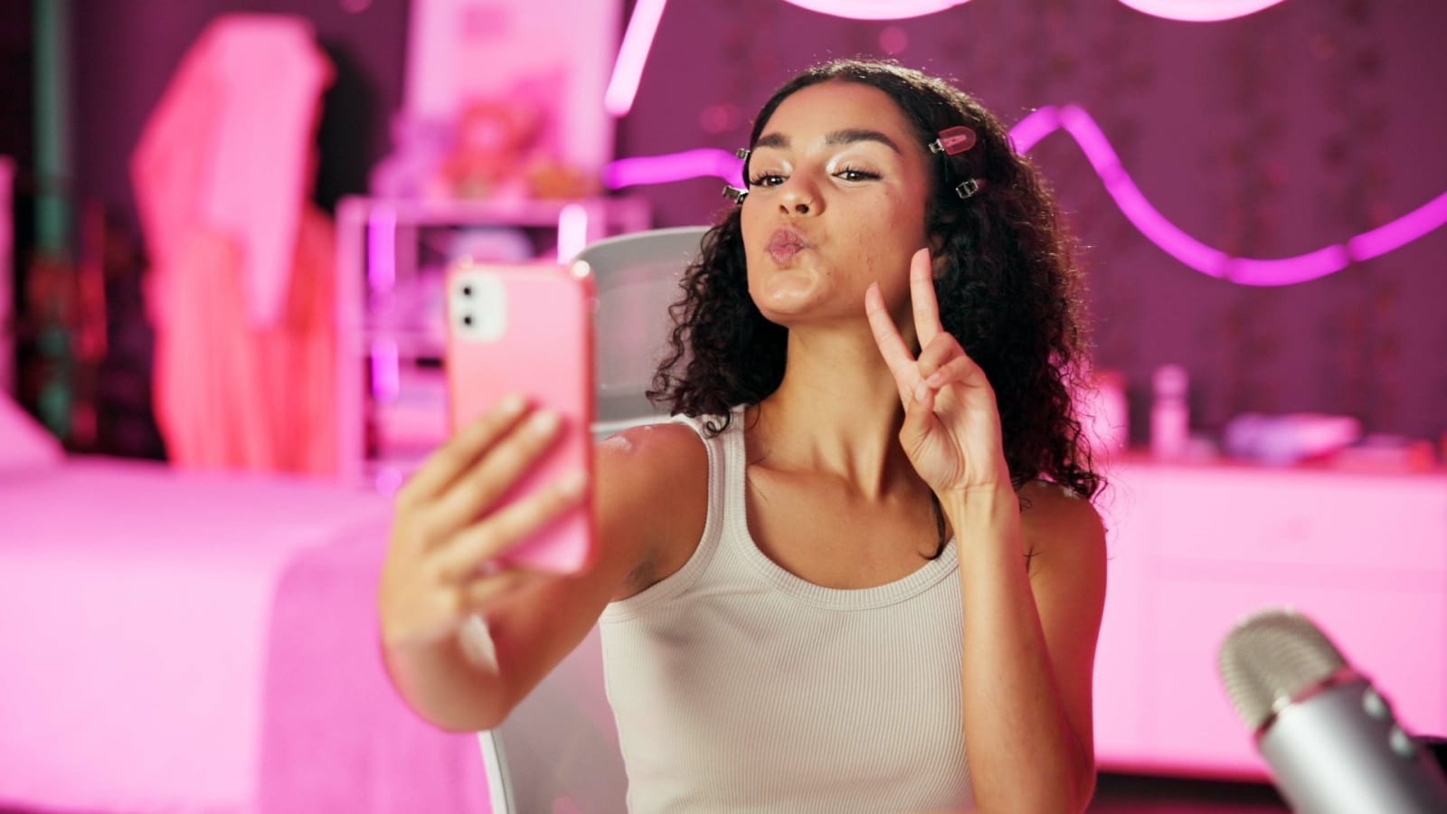 A young woman makes a duck face to her followers to represent the crazy fads and popular fads that all vanished.