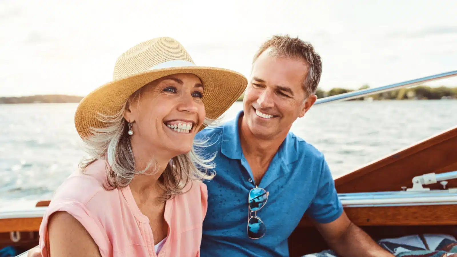 A happy older couple can afford to spend their retirement years boating as an unexpected consequence of not having kids.