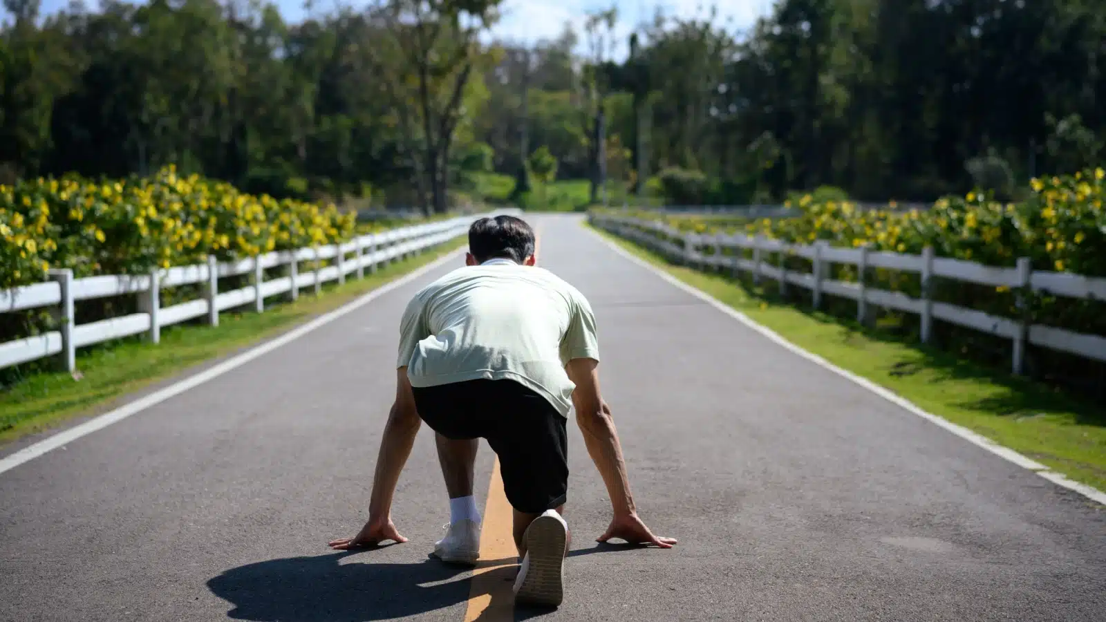 A person gets up early in the morning to train as a runner, representing self-discipline.