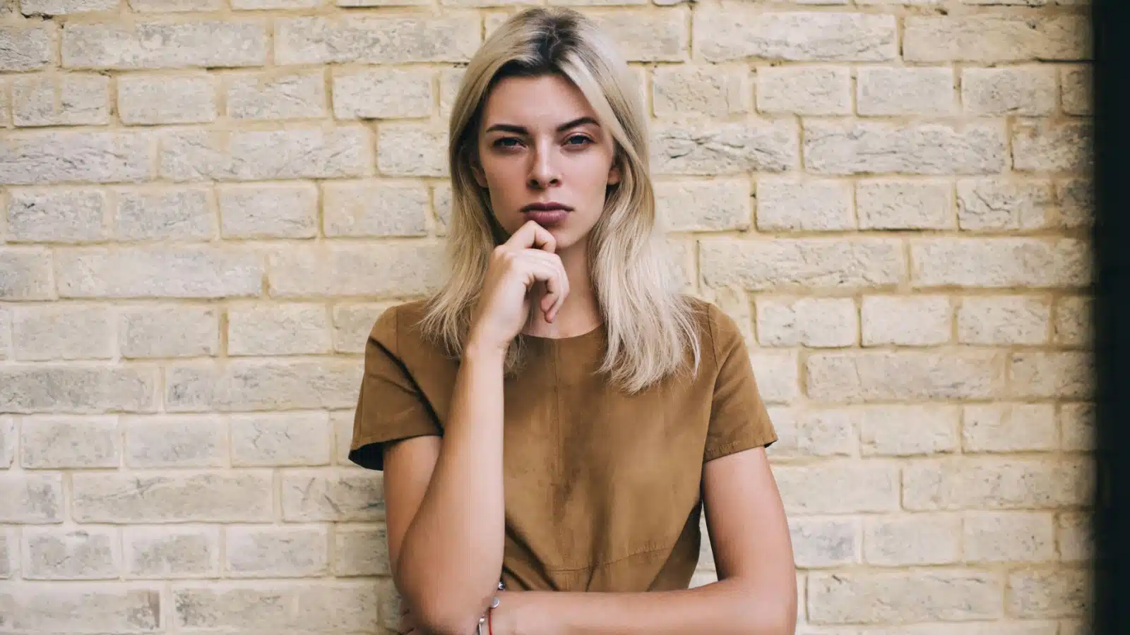 An unsure woman with a skeptical look on her face.