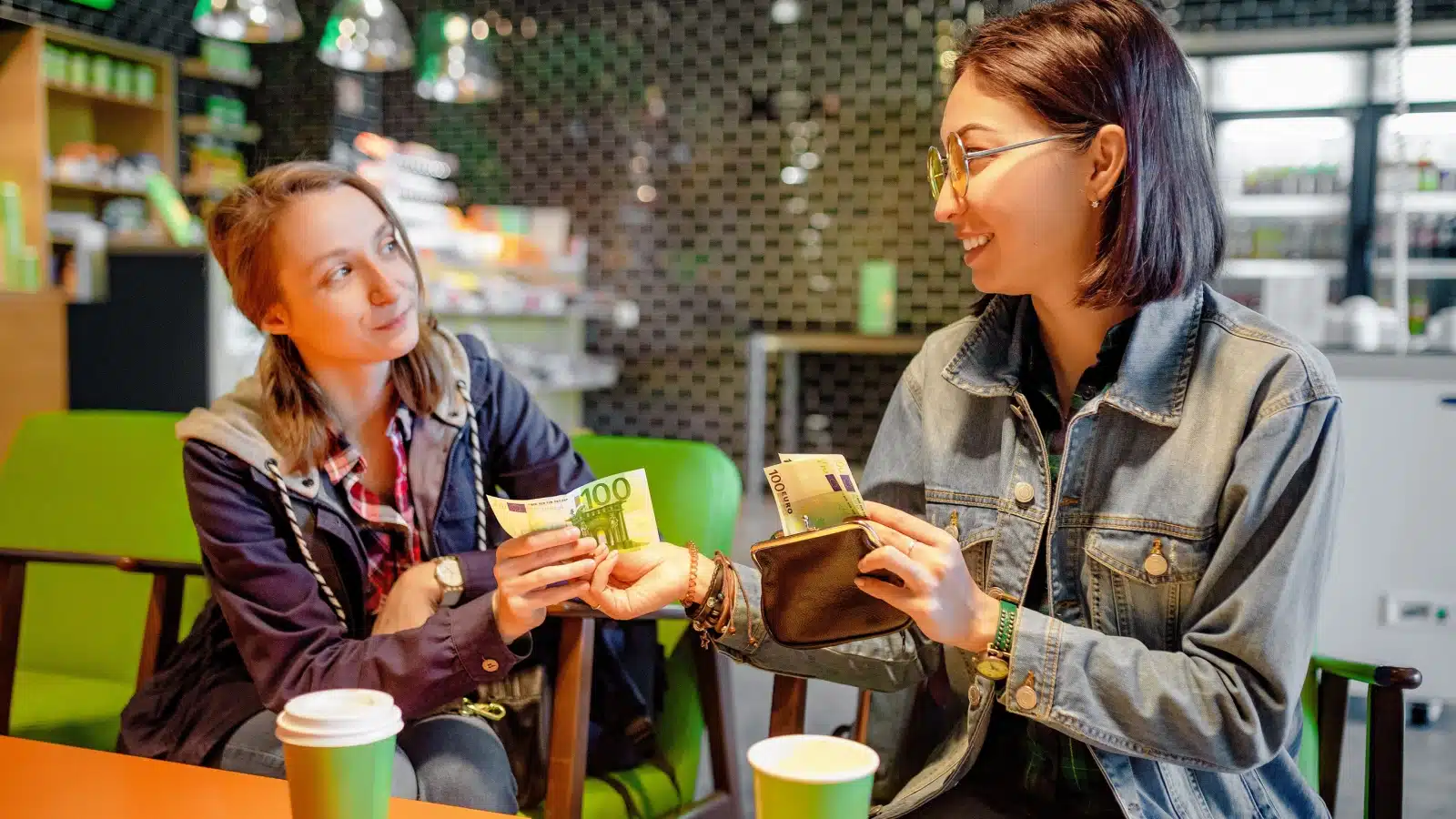 A woman borrows money from her friend. 