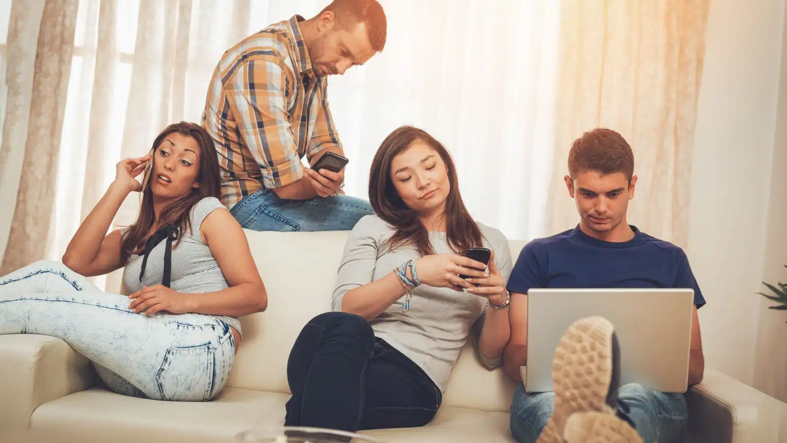 A group of friends hanging out, but they're all on their phones, bored out of their minds, to represent how to stop being boring.