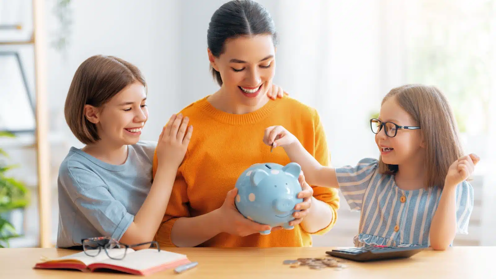 A mom teaches her children to save money.