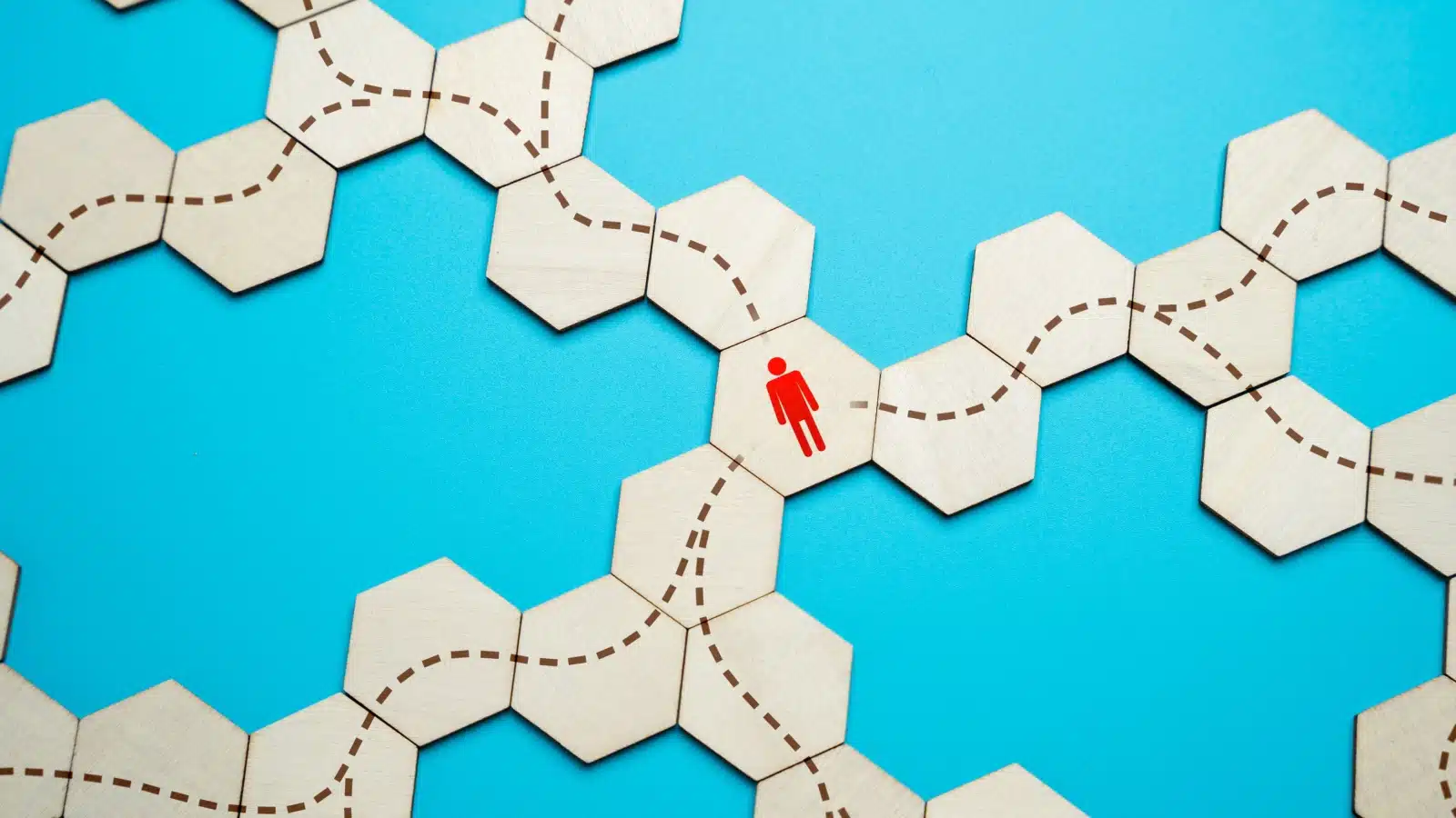 A wooden icon with a red human symbol can choose between three different paths.