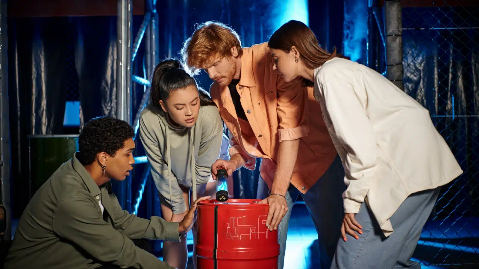 Friends solving a puzzle at an escape room game.