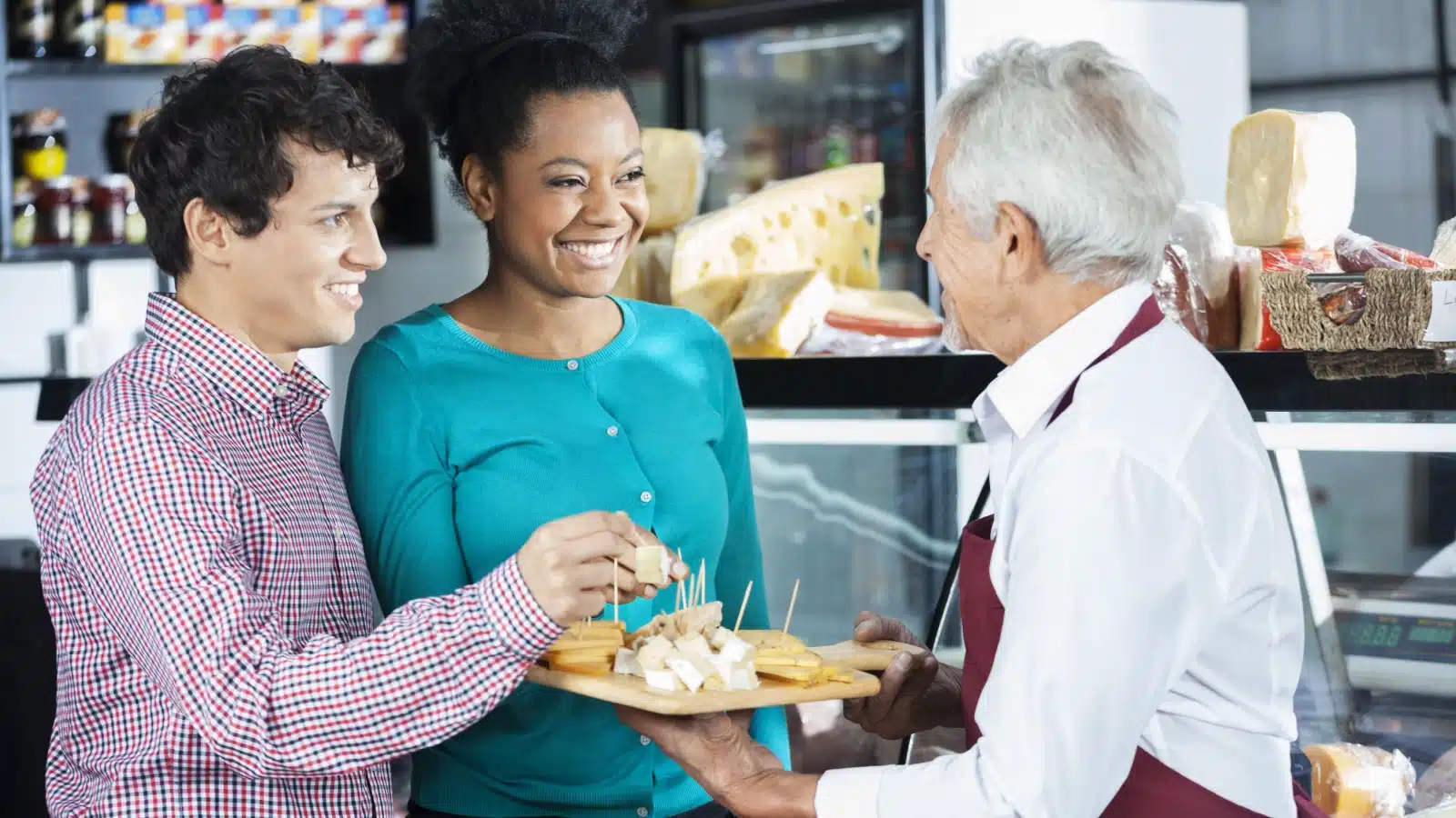 A cheese shop offers free samples to customers.