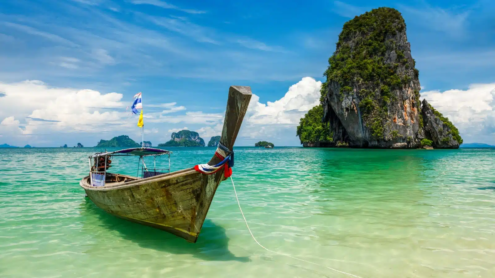 A long boat in a bay near Krabi, Thailand.
