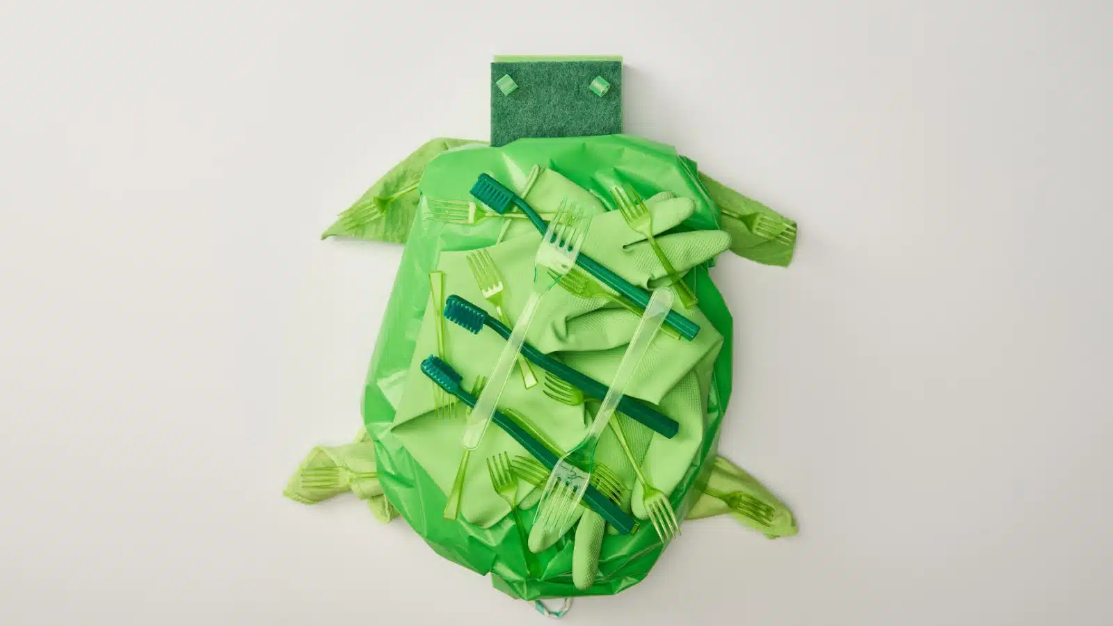 A turtle made from various green plastic materials.