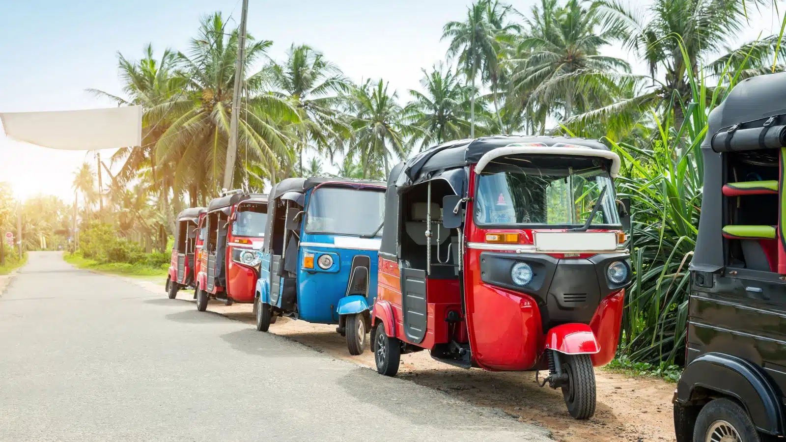 A line of tuktuk taxis.