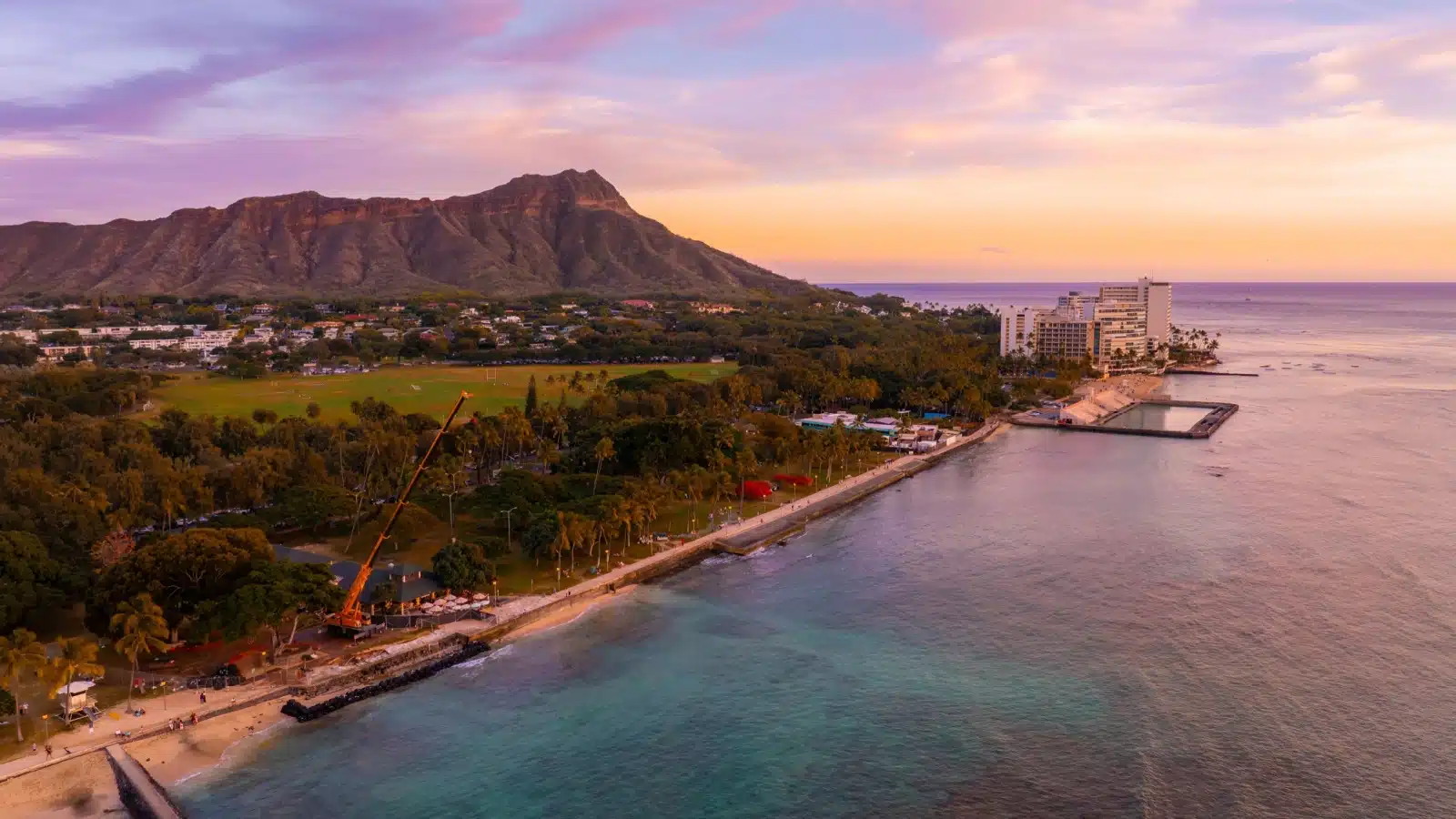 Aerial view of Waikiki Beach at sunset.
