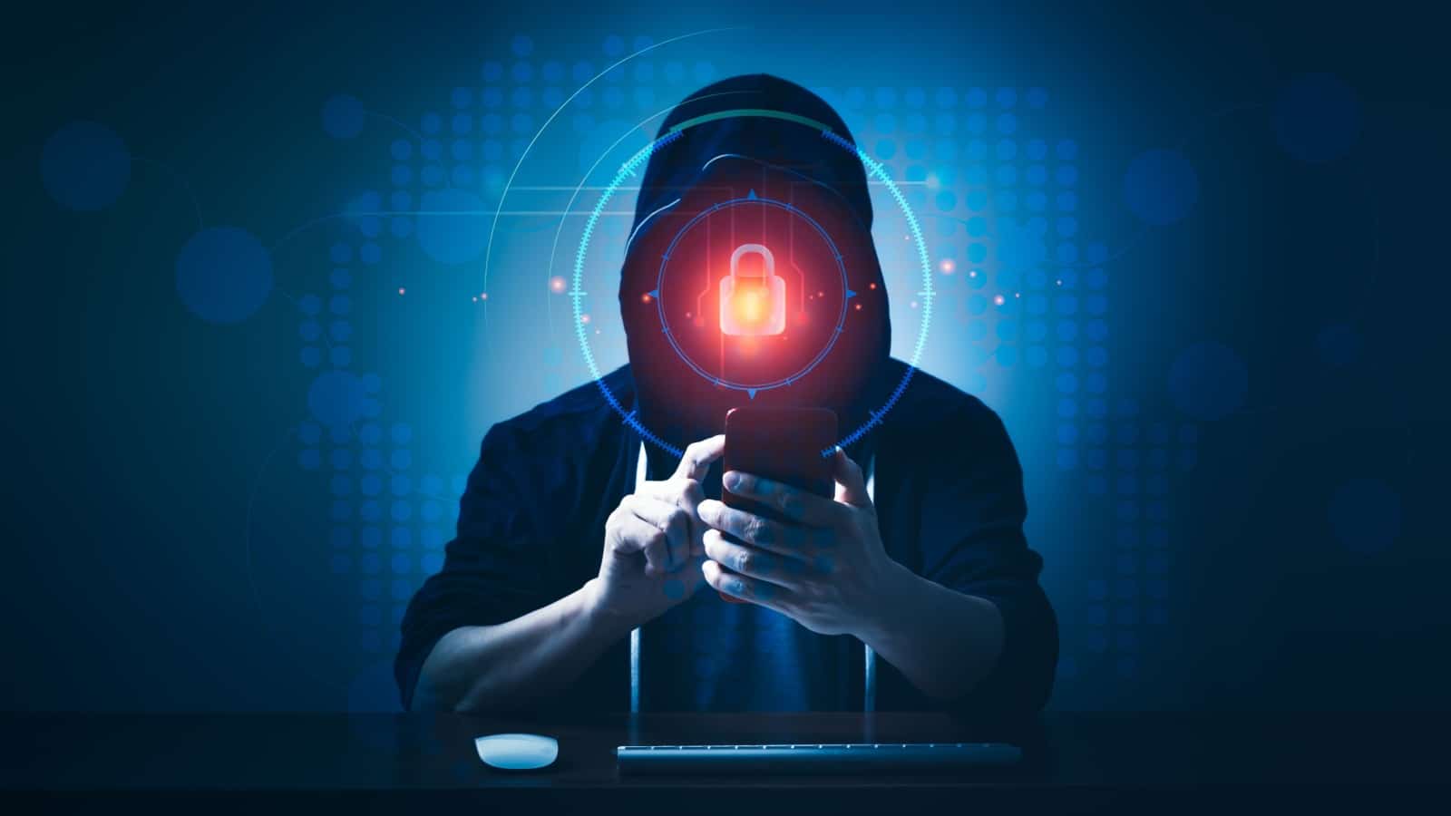 What is identity theft? A hooded hacker attempts to unlock a cellphone in this artistic representation of identity theft.