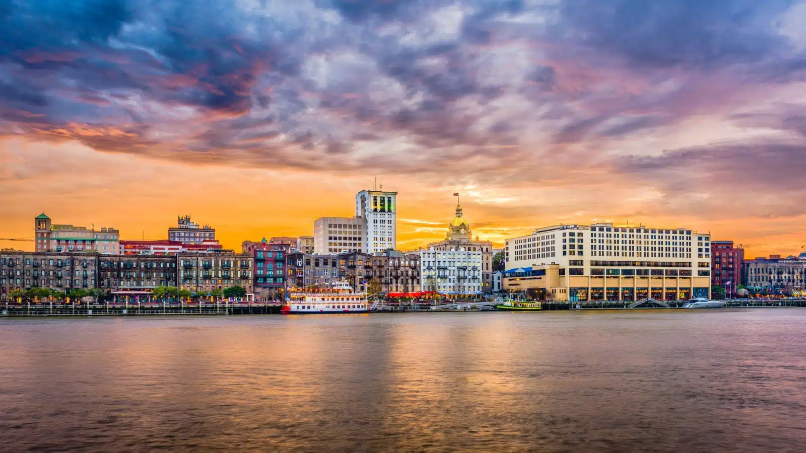 A distant view of the Savannah, GA skyline from across the river.