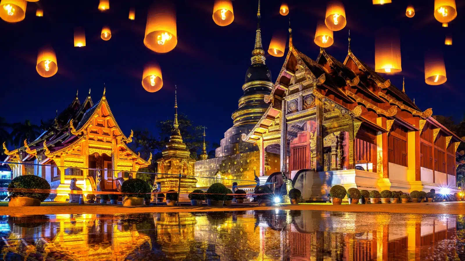 Yee peng festival and sky lanterns at Wat Phra Singh temple at night in Chiang Mai, Thailand.
