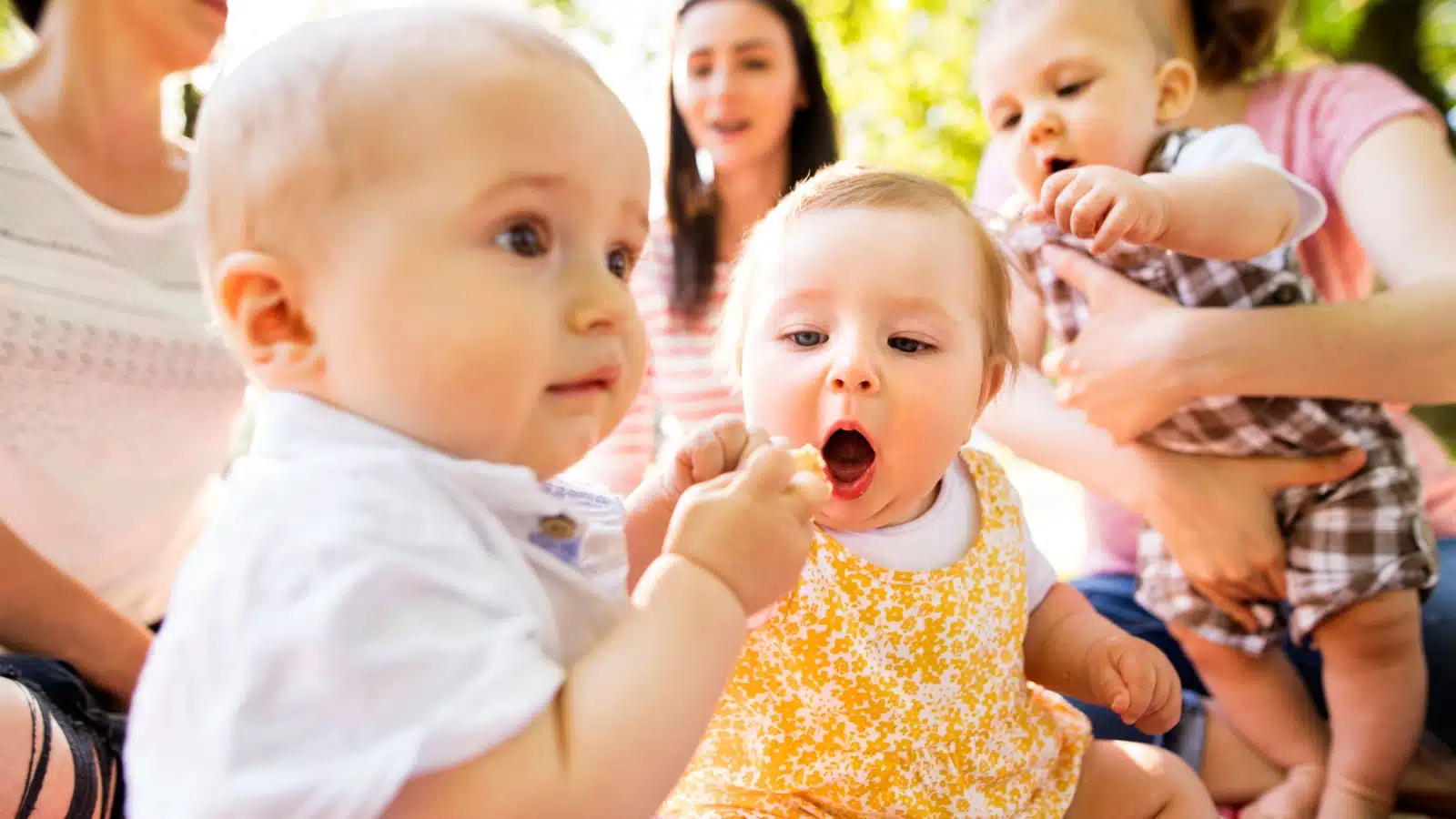 moms and their babies to represent the idea that it takes a village to raise a child.