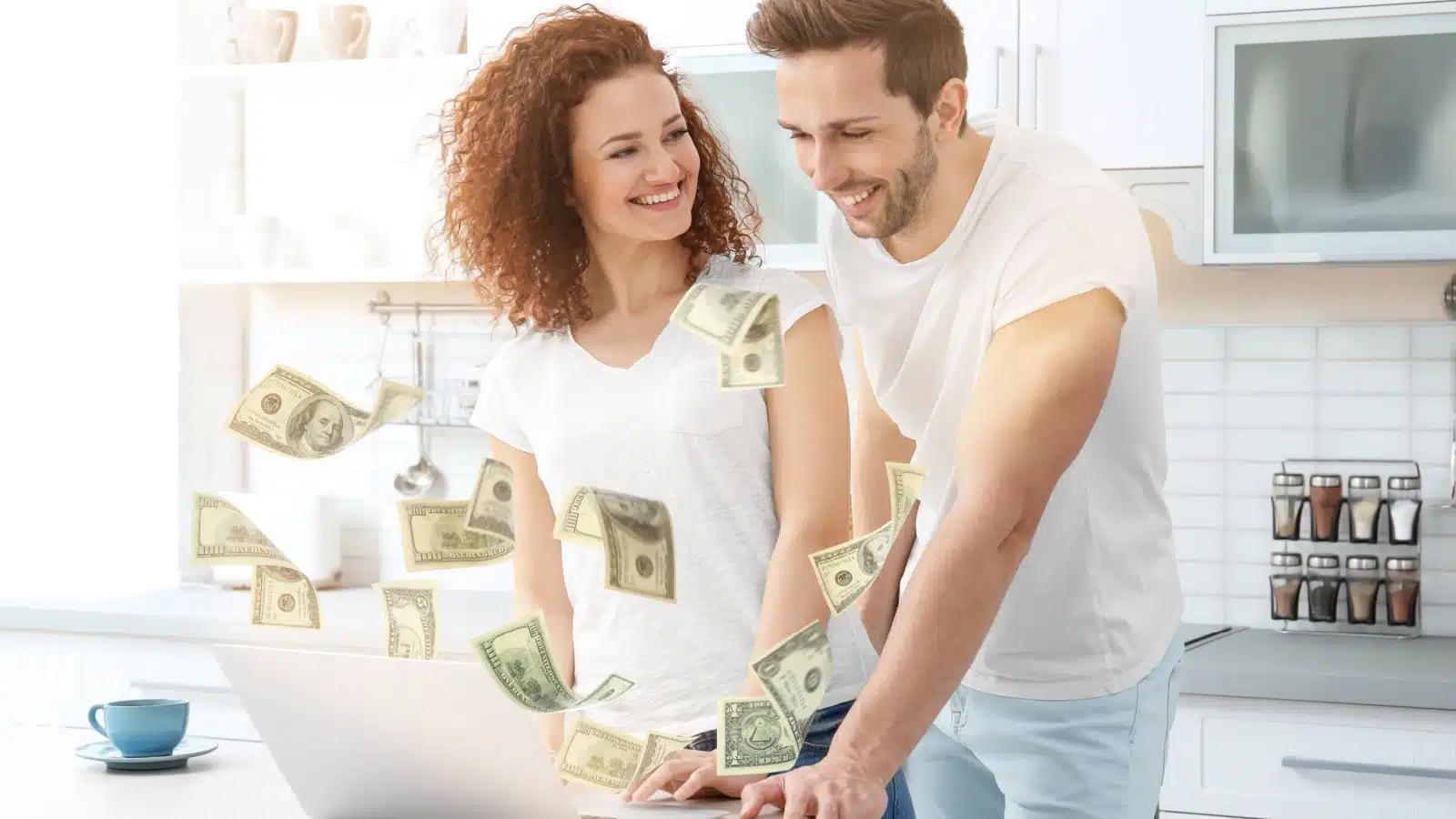 A happy couple stands in front of their laptop, which has dollars floating out of it, to represent making money online.