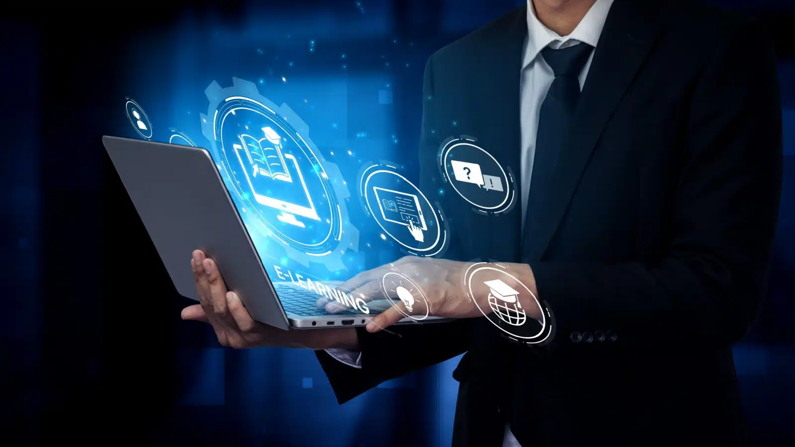 A businessman holds a computer while navigating the best online learning platforms for career enhancement.